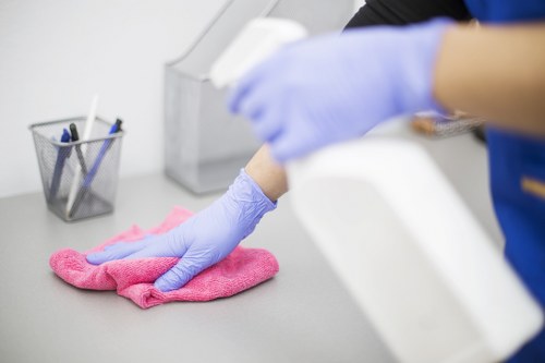 Office cleaners working in a Kensington business workspace