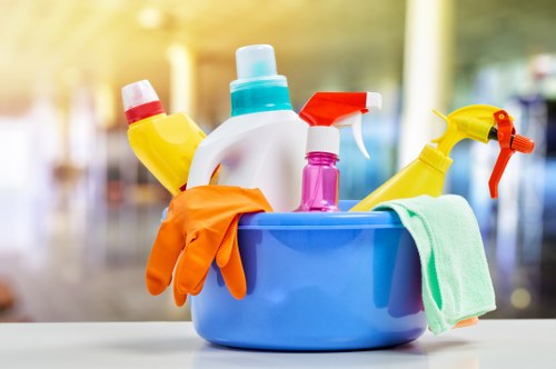 Professional cleaner working in a Kensington flat with careful attention to detail
