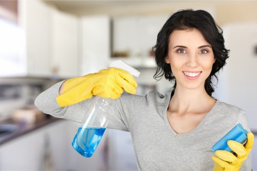 Cleaner working on stairs and landing carpets in Kensington